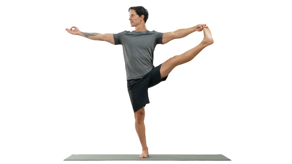 Unrecognizable crop male balancing in Toe Stand pose and doing yoga  barefoot on mat at sundown in city Stock Photo | Adobe Stock
